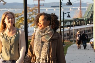 Diverse students walking to campus together.